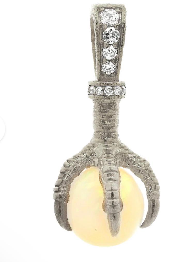 The Eagle pendant — white-gold talon and fire-opal sphere