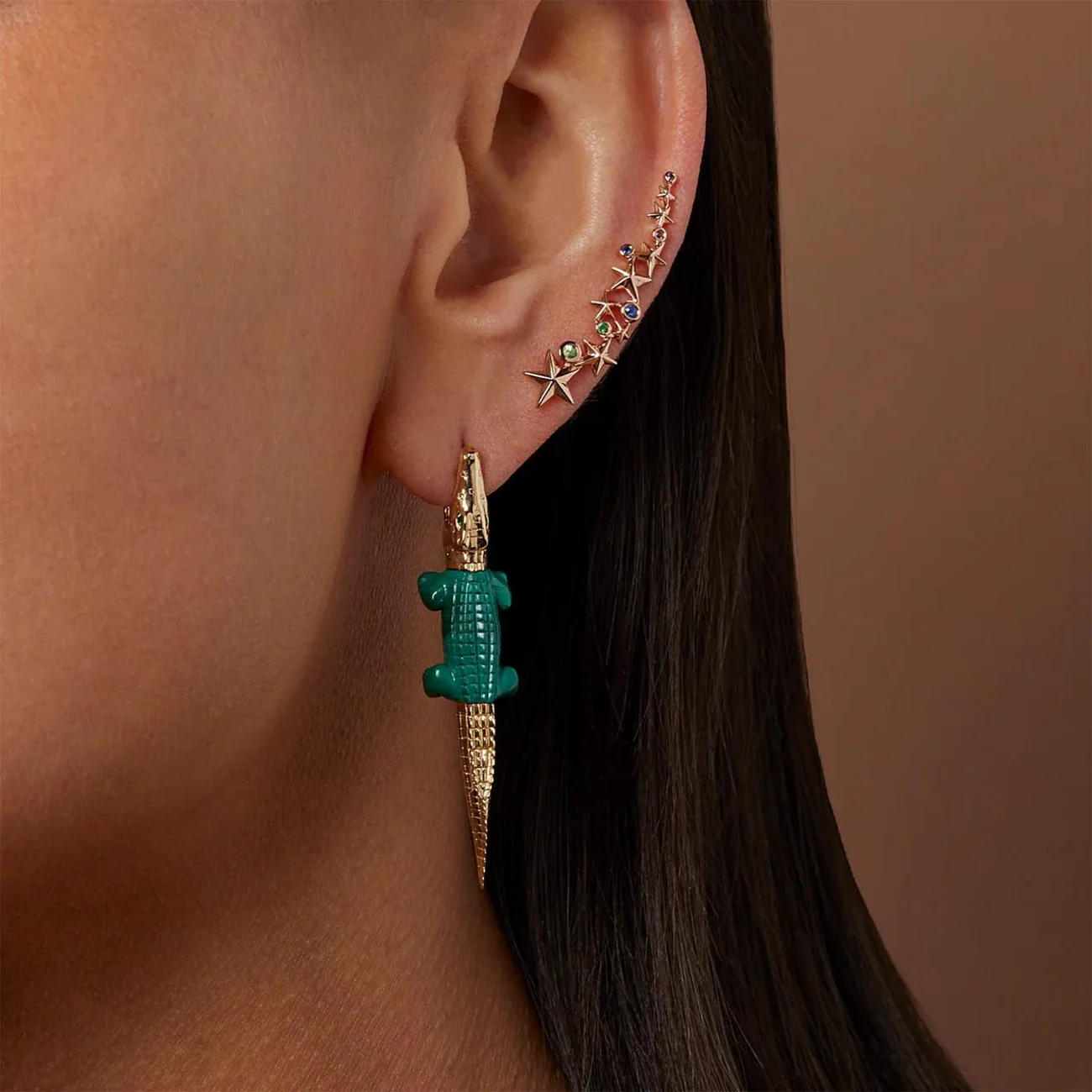 The Alligator earring worn
